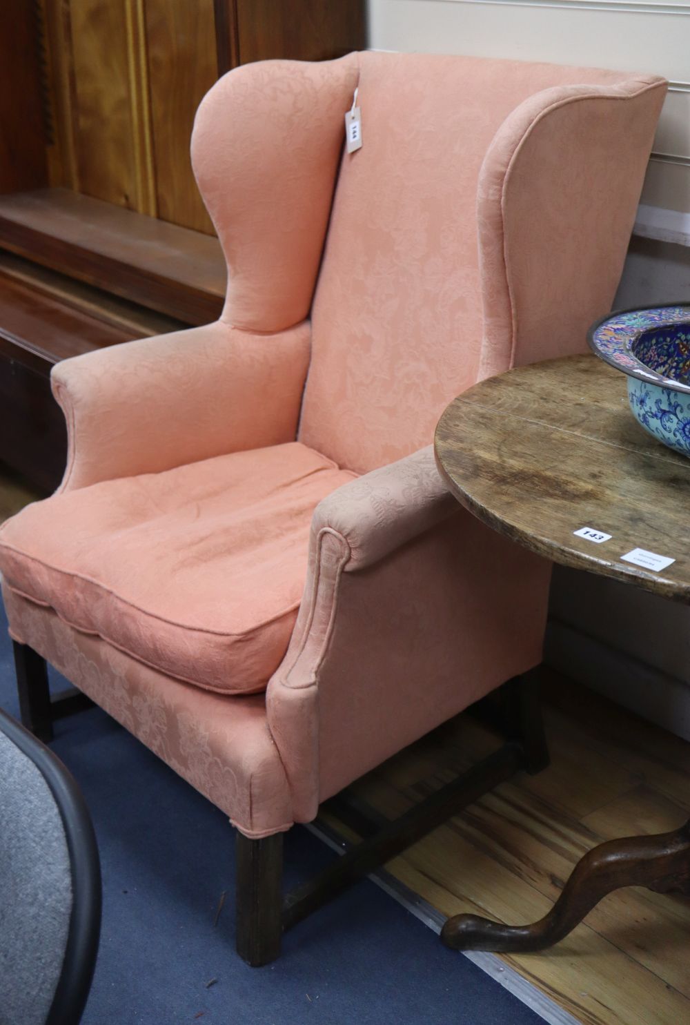 A Georgian style mahogany wing armchair